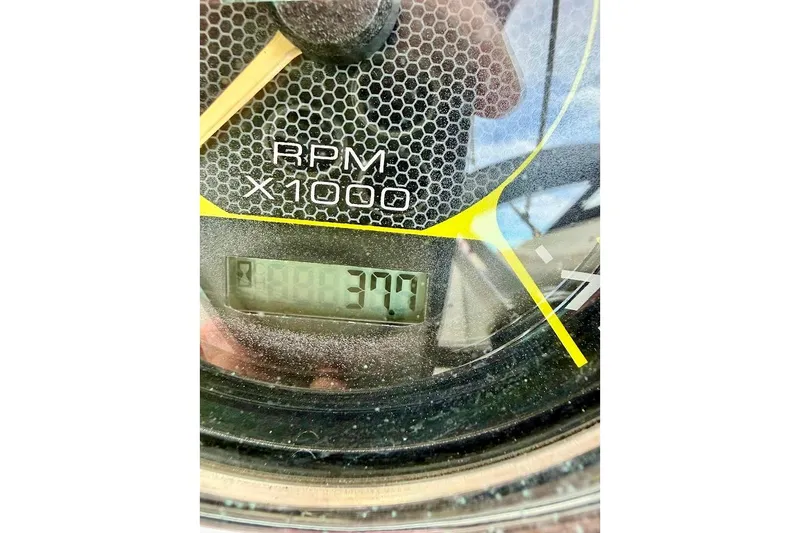 Slide: The Image of Close-up of a 2020 Sea Ray SPX 210 Outboard tachometer displaying 370 RPM. - 32