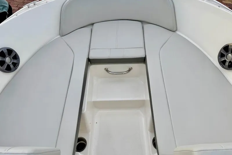 Slide: The Image of Interior seating of 2020 Sea Ray SPX 210 Outboard boat with speakers and handle. - 34