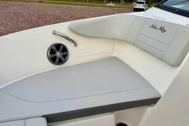 Slide: The Image of 2020 Sea Ray SPX 210 Outboard boat interior with speaker and cushioned seating. - 35