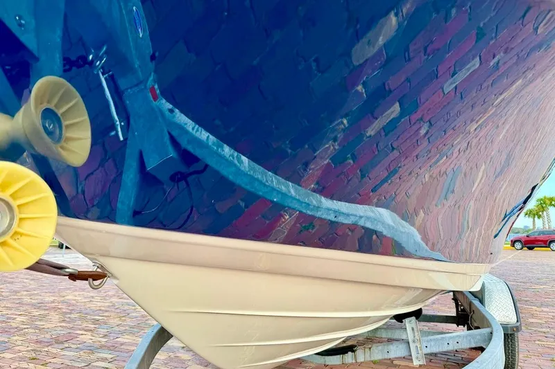 Slide: The Image of 2020 Sea Ray SPX 210 Outboard boat on trailer, reflecting surroundings. - 6