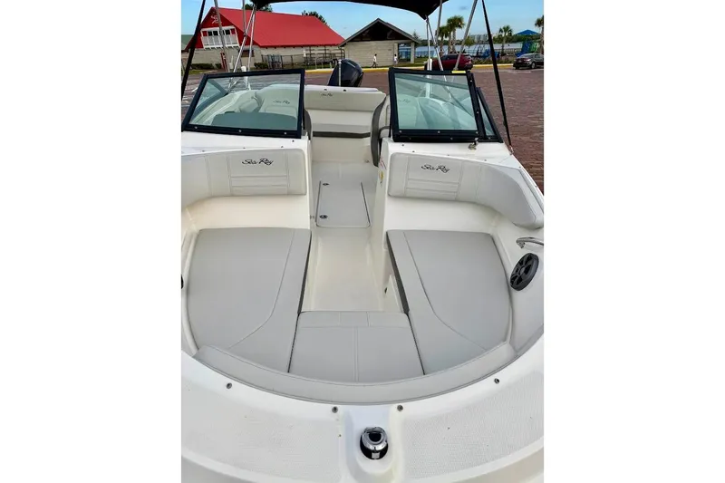Slide: The Image of 2020 Sea Ray SPX 210 Outboard boat interior with spacious seating and modern design. - 7