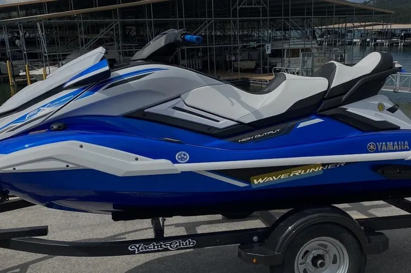 The Image of 2021 Yamaha WaveRunner FX Cruiser HO in blue and white on a trailer. - 0