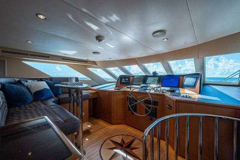Slide: The Image of Luxurious 2003 Hatteras 100 Raised Pilothouse yacht interior with panoramic ocean views. - 14