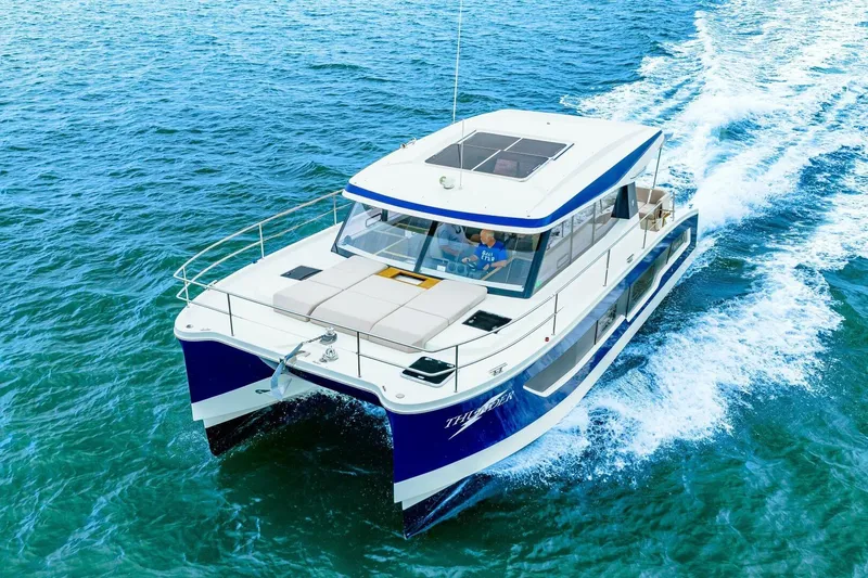 Slide: The Image of 2021 Fountaine Pajot MY4.S yacht cruising on open water, showcasing sleek design and luxury. - 101