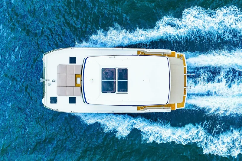 Slide: The Image of Aerial view of 2021 Fountaine Pajot MY4.S yacht cruising on blue ocean waters. - 106