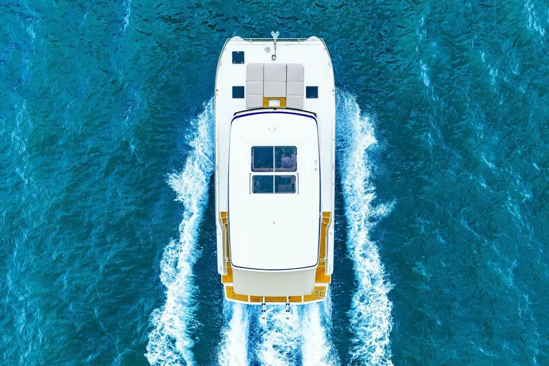 Slide: The Image of Aerial view of 2021 Fountaine Pajot MY4.S yacht cruising on blue ocean waters. - 107