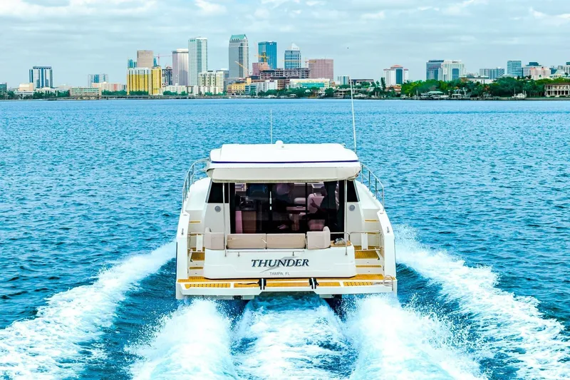 Slide: The Image of 2021 Fountaine Pajot MY4.S cruising near city skyline on blue water. - 108