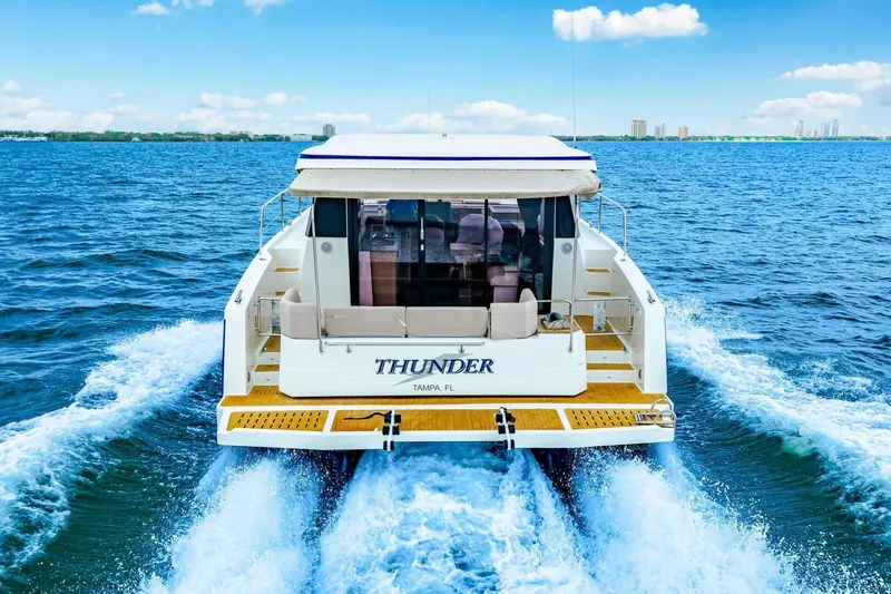 Slide: The Image of 2021 Fountaine Pajot MY4.S yacht cruising on open water, rear view. - 110