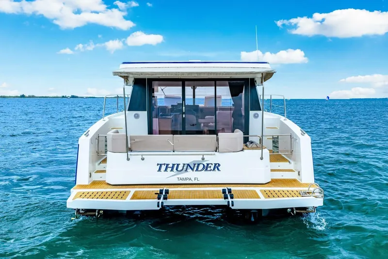 Slide: The Image of 2021 Fountaine Pajot MY4.S yacht "Thunder" on open sea, rear view. - 111