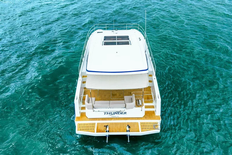 Slide: The Image of 2021 Fountaine Pajot MY4.S yacht on clear blue water, rear view. - 113