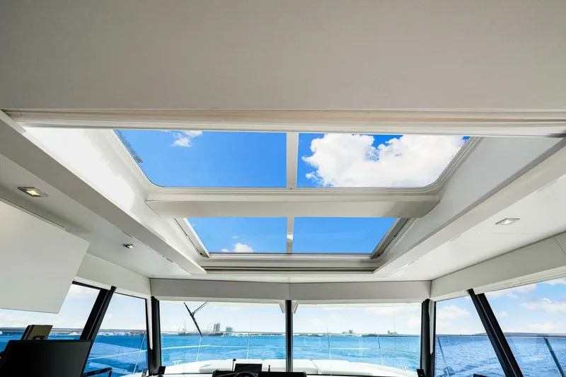 Slide: The Image of Interior view of 2021 Fountaine Pajot MY4.S yacht with panoramic windows and skylight. - 15