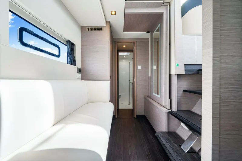 Slide: The Image of Modern interior of 2021 Fountaine Pajot MY4.S yacht with sleek design and white seating. - 21