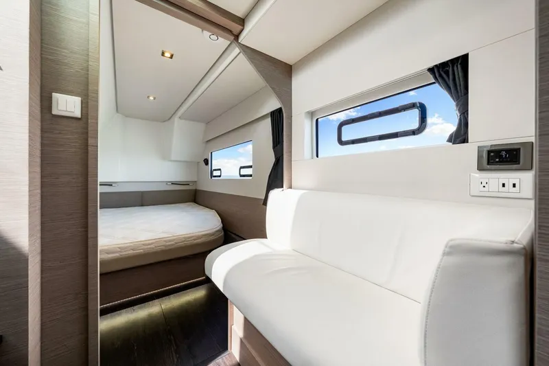 Slide: The Image of Luxurious interior of 2021 Fountaine Pajot MY4.S yacht with modern furnishings and large windows. - 22