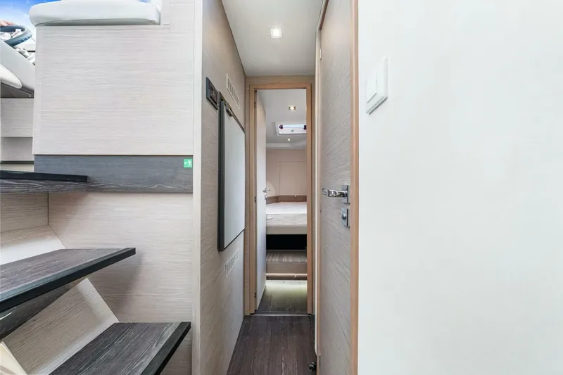 Slide: The Image of Interior hallway of 2021 Fountaine Pajot MY4.S yacht, featuring modern design and wooden accents. - 23