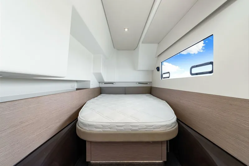 Slide: The Image of 2021 Fountaine Pajot MY4.S cabin interior with bed and window view. - 24