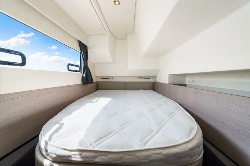 Slide: The Image of Cabin interior of 2021 Fountaine Pajot MY4.S yacht with bed and window view. - 25