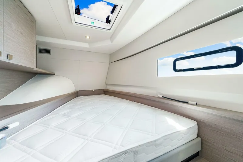 Slide: The Image of Luxurious cabin interior of 2021 Fountaine Pajot MY4.S yacht with skylight and window. - 26