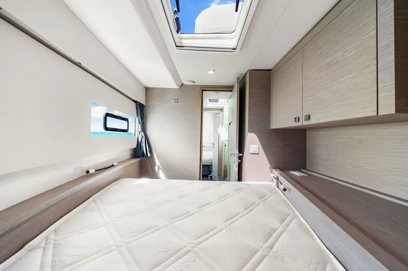 Slide: The Image of Luxurious cabin interior of 2021 Fountaine Pajot MY4.S yacht with skylight and modern furnishings. - 30