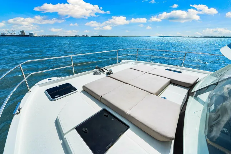 Slide: The Image of 2021 Fountaine Pajot MY4.S yacht deck with sun loungers on open sea. - 36