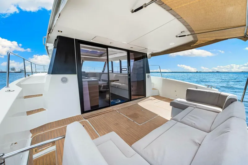Slide: The Image of Luxurious 2021 Fountaine Pajot MY4.S yacht deck with seating, overlooking serene ocean. - 42