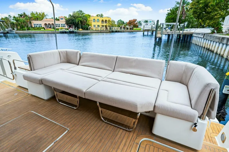 Slide: The Image of Luxurious seating on 2021 Fountaine Pajot MY4.S yacht, overlooking serene waterfront. - 46