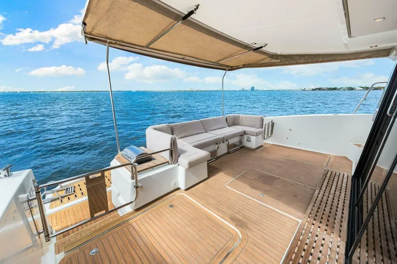 Slide: The Image of Luxury 2021 Fountaine Pajot MY4.S yacht deck with ocean view and seating area. - 47