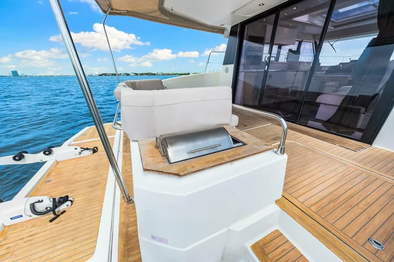 Slide: The Image of Luxury 2021 Fountaine Pajot MY4.S yacht deck with ocean view and seating area. - 49