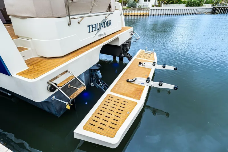 Slide: The Image of 2021 Fountaine Pajot MY4.S yacht with extended swim platform in marina. - 51