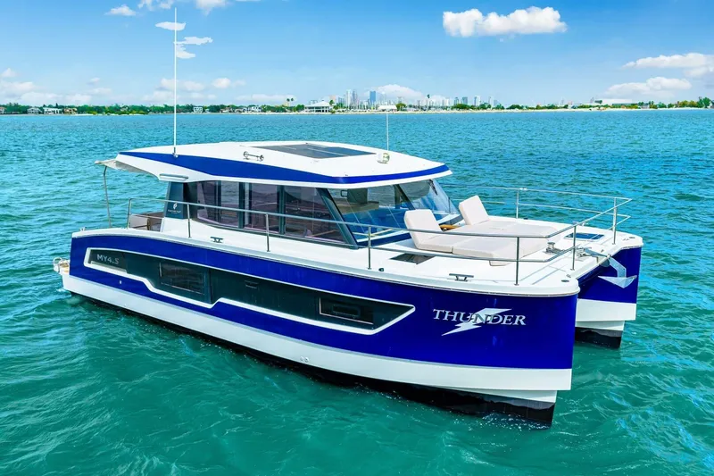 Slide: The Image of 2021 Fountaine Pajot MY4.S catamaran "Thunder" on blue ocean waters. - 57