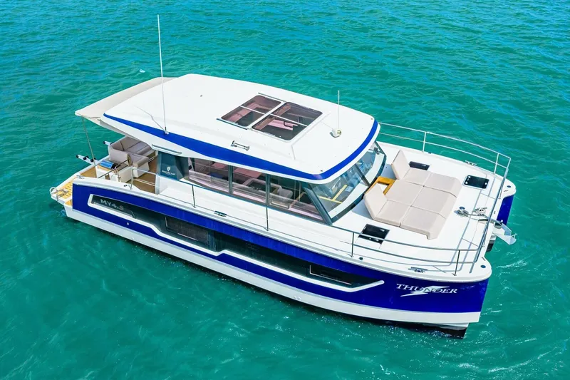 Slide: The Image of 2021 Fountaine Pajot MY4.S yacht on turquoise water, aerial view. - 58