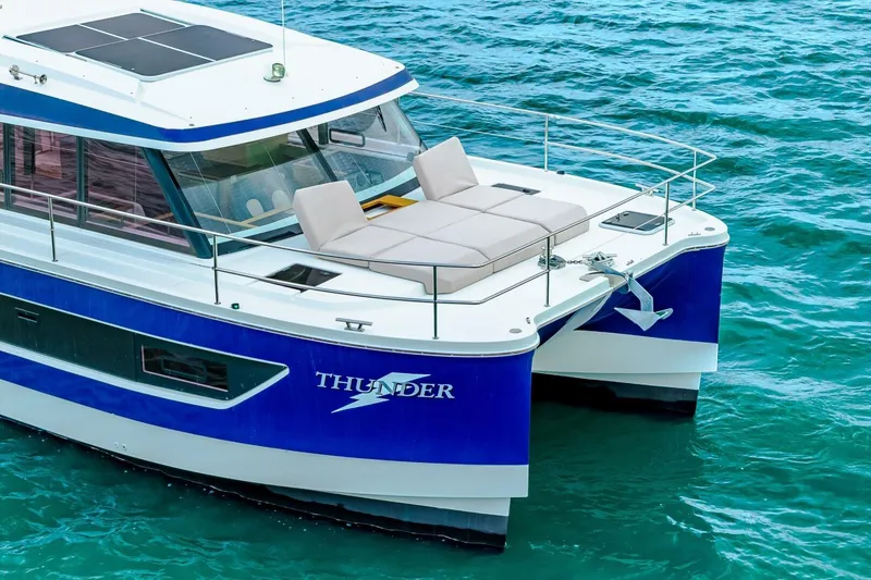 Slide: The Image of 2021 Fountaine Pajot MY4.S catamaran on blue water, featuring spacious deck and modern design. - 61