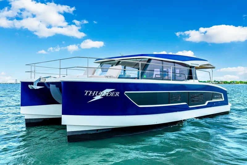 Slide: The Image of 2021 Fountaine Pajot MY4.S catamaran "Thunder" on blue ocean under clear sky. - 64