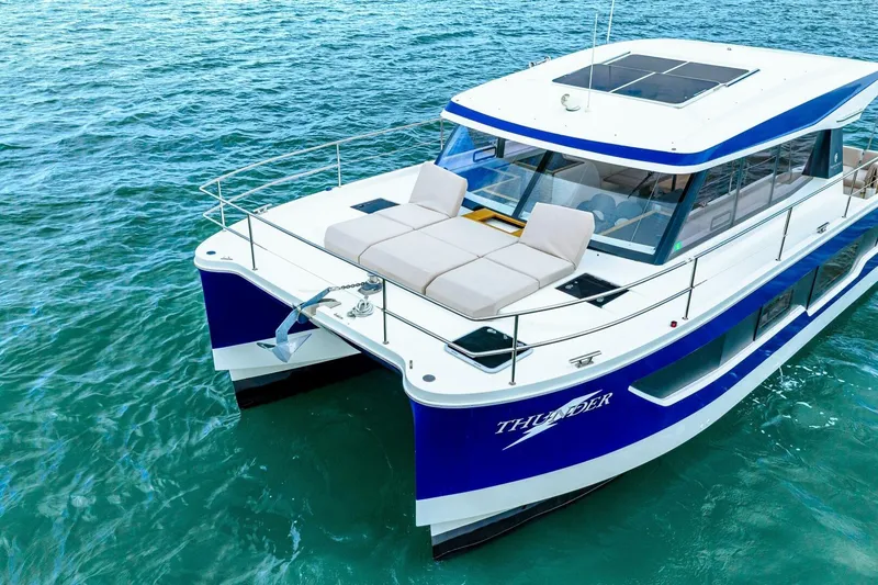Slide: The Image of 2021 Fountaine Pajot MY4.S yacht on blue ocean water, featuring spacious deck and modern design. - 70