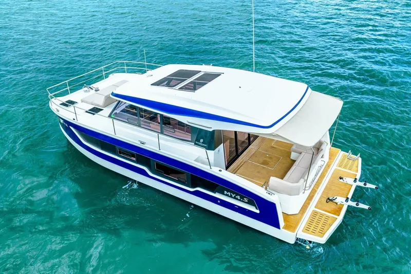 Slide: The Image of 2021 Fountaine Pajot MY4.S yacht cruising on clear blue water. - 71