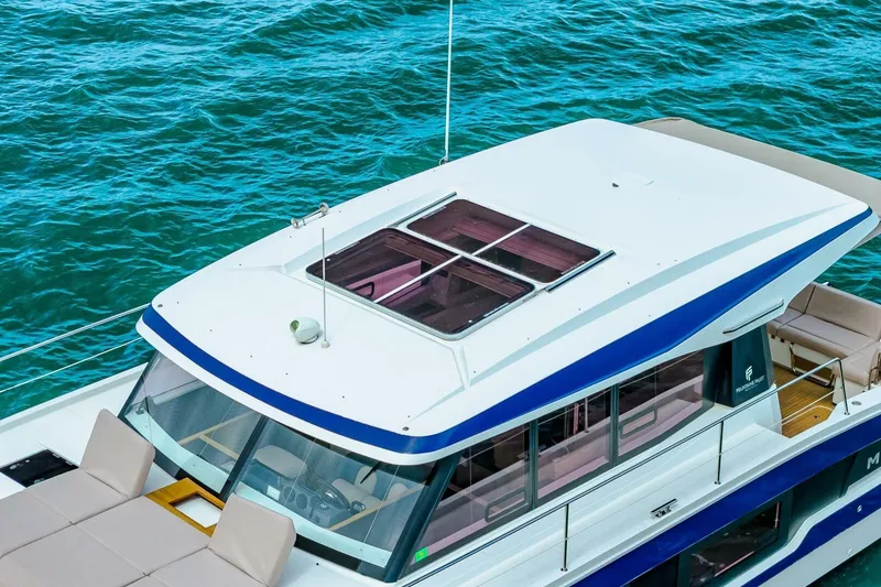 Slide: The Image of 2021 Fountaine Pajot MY4.S yacht with sleek design on blue ocean water. - 72