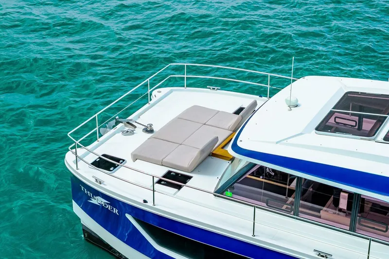 Slide: The Image of Fountaine Pajot MY4.S 2021 yacht on turquoise water, featuring a sunbathing deck. - 75