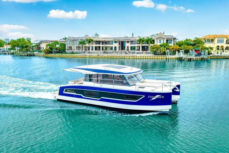 Slide: The Image of 2021 Fountaine Pajot MY4.S yacht cruising on a scenic waterfront. - 80