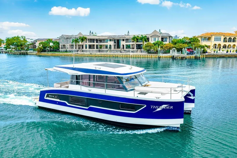 Slide: The Image of 2021 Fountaine Pajot MY4.S yacht cruising near waterfront homes. - 81
