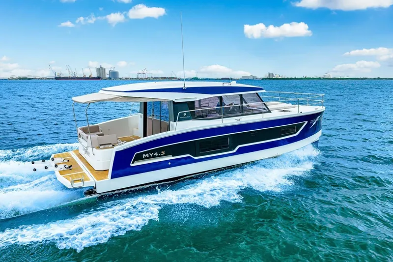 Slide: The Image of 2021 Fountaine Pajot MY4.S motor yacht cruising on blue ocean waters. - 89