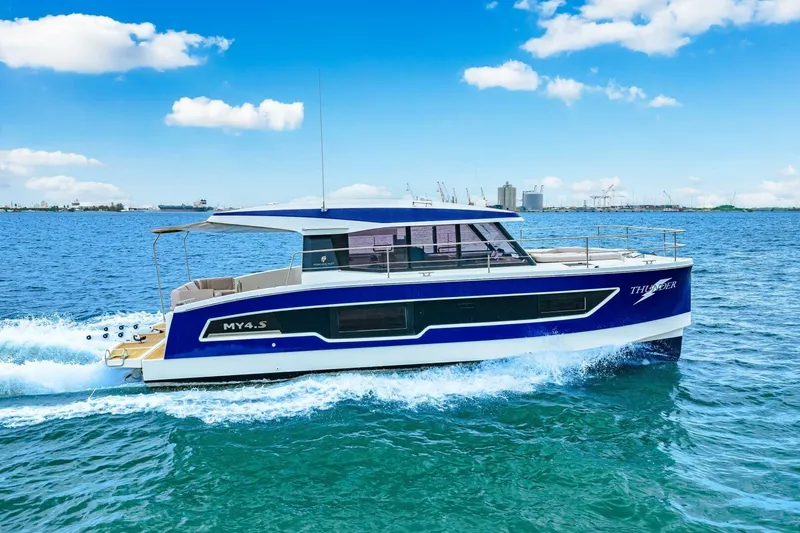 Slide: The Image of 2021 Fountaine Pajot MY4.S yacht cruising on blue ocean waters under clear skies. - 90