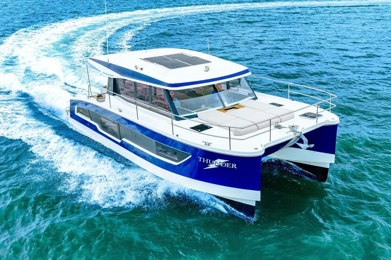 Slide: The Image of 2021 Fountaine Pajot MY4.S yacht cruising on open water, showcasing sleek design. - 91