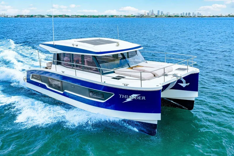 Slide: The Image of 2021 Fountaine Pajot MY4.S catamaran cruising on blue ocean waters. - 92