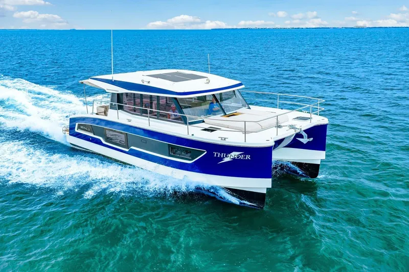 Slide: The Image of 2021 Fountaine Pajot MY4.S yacht cruising on open blue sea. - 93