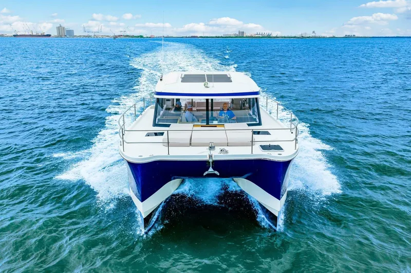 Slide: The Image of 2021 Fountaine Pajot MY4.S yacht cruising on open blue water. - 95