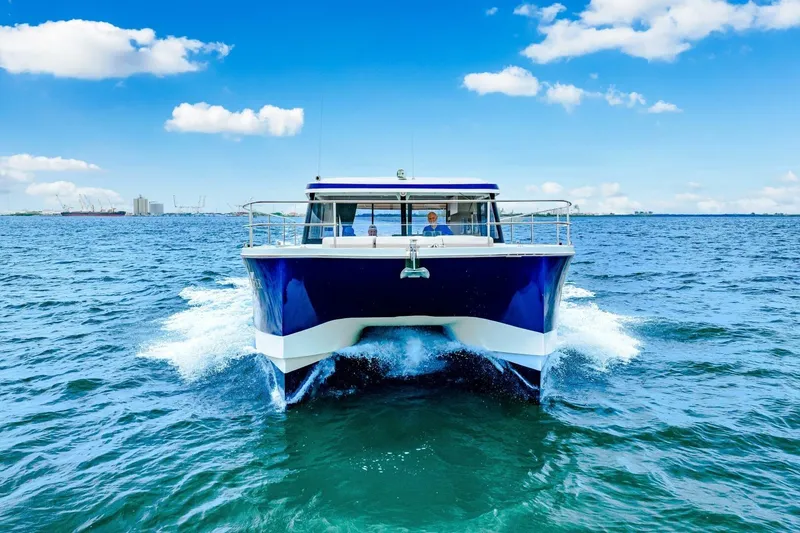 Slide: The Image of 2021 Fountaine Pajot MY4.S yacht cruising on open water under blue sky. - 96