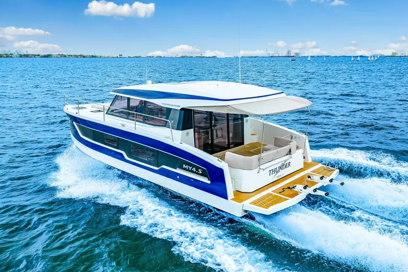 Slide: The Image of 2021 Fountaine Pajot MY4.S yacht cruising on open blue water. - 97