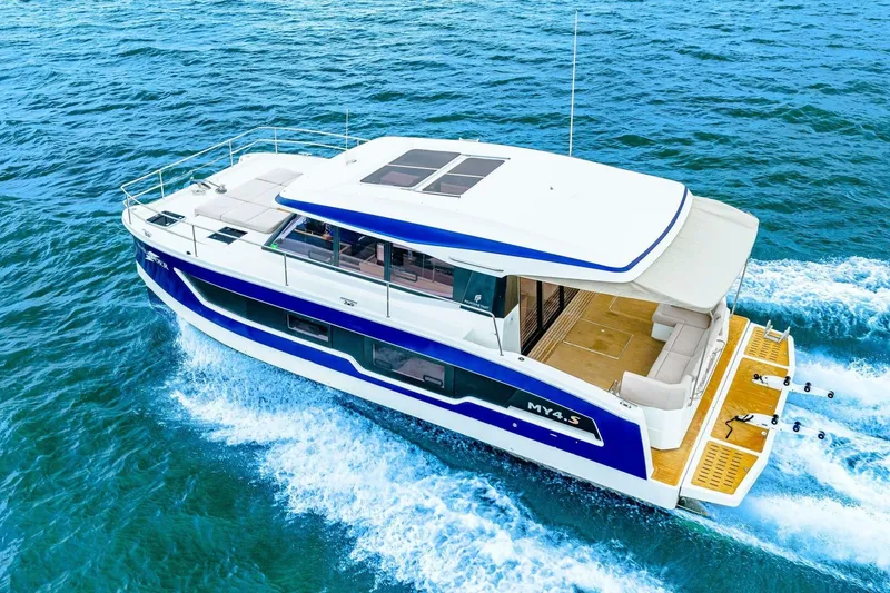 Slide: The Image of 2021 Fountaine Pajot MY4.S yacht cruising on open blue waters. - 98