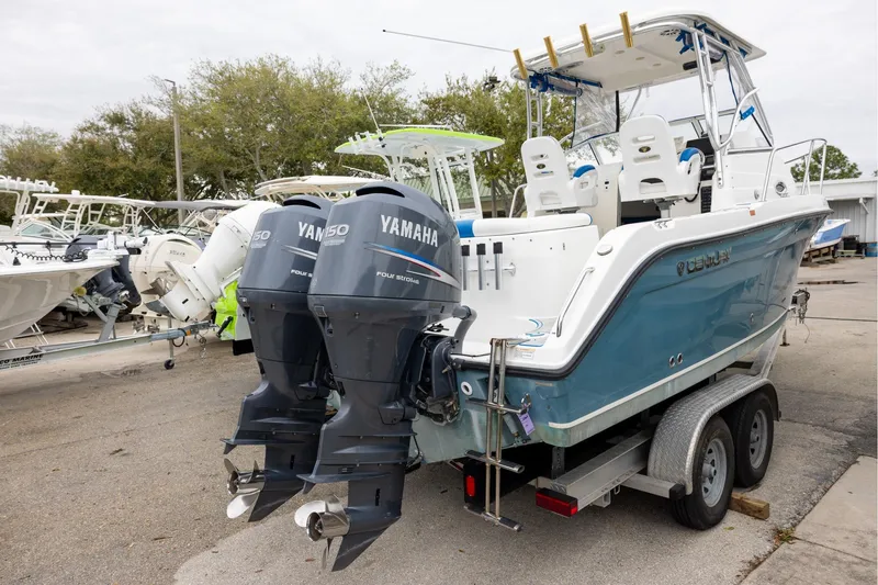 Slide: The Image of 2008 Century 2400 Walk-Around boat with twin Yamaha 150 engines on a trailer. - 3
