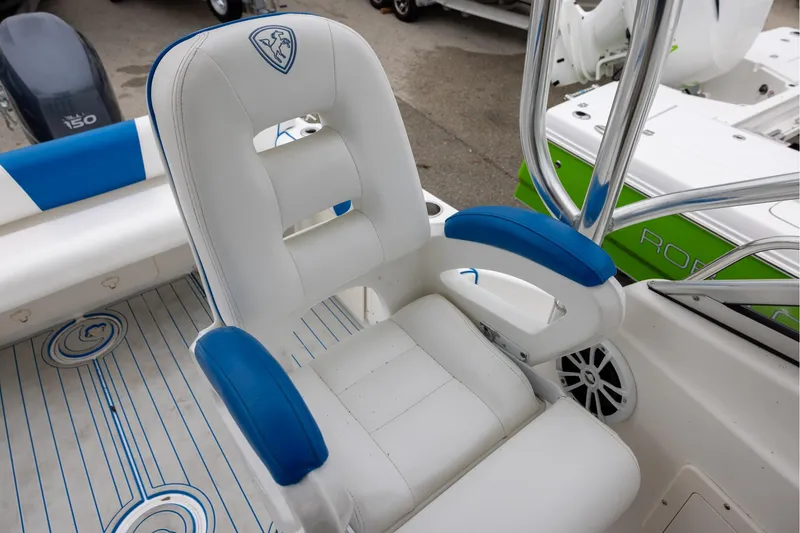 Slide: The Image of Century 2400 Walk-Around 2008 boat seat with blue and white upholstery. - 9