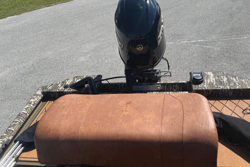 Slide: The Image of 2026 Avid 18 Rogue CC boat with Yamaha outboard motor and brown leather seat. - 11